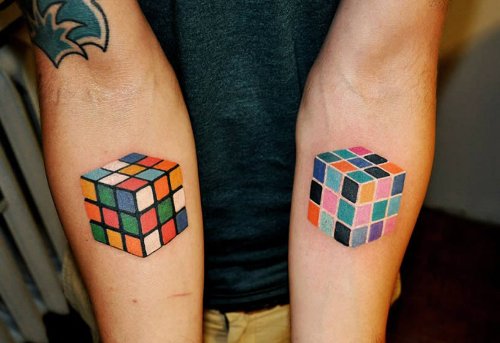 Optical Illusion Puzzle Game Box Color Ink Tattoos on Both Arms